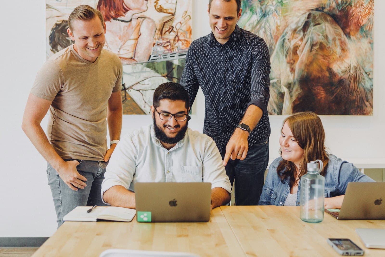 Colleagues looking at a laptop
