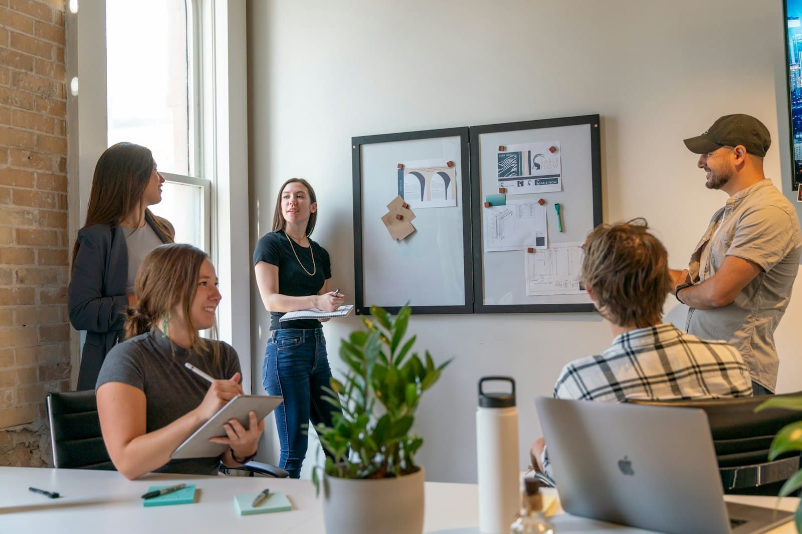 A small team working together in a bright meeting room
